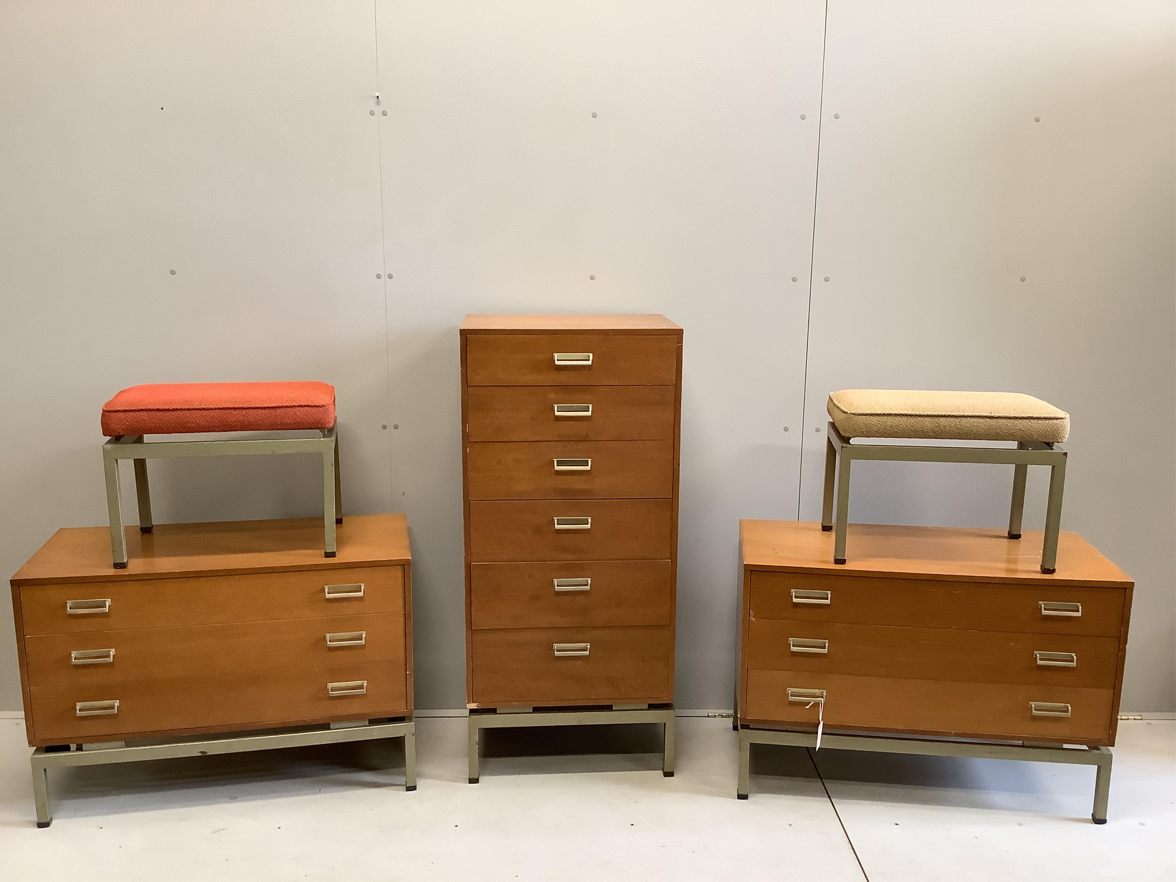 A mid century G Plan Limba teak five piece bedroom suite comprising tall chest, a pair of low chests and a pair of stools